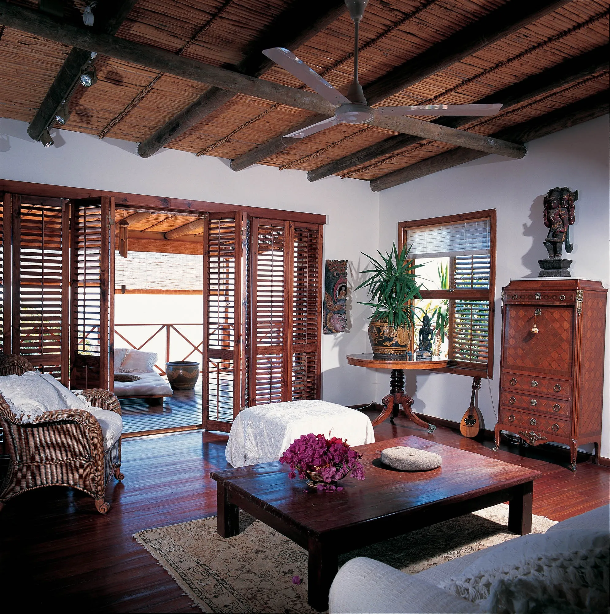 Timber shutters opening onto a covered verandah