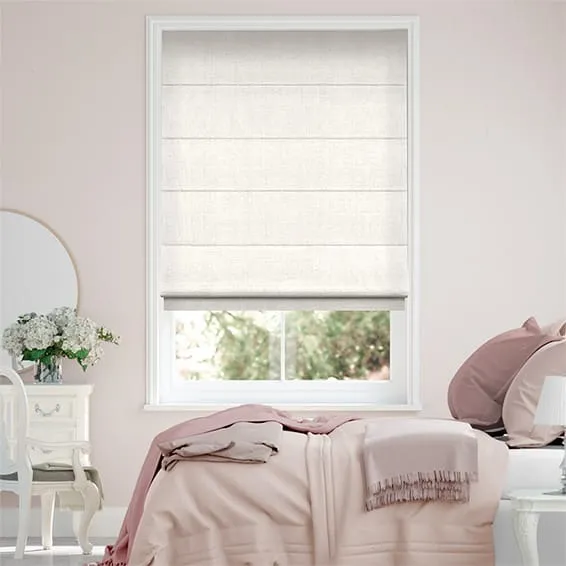 White linen roman blind on a bedroom window